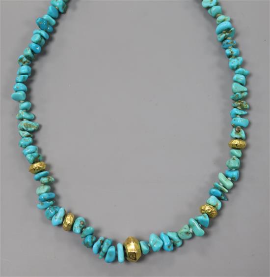 A single strand turquoise and yellow metal spacer necklace, with 750 clasp, 43cm.